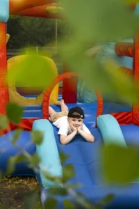 Step-by-step bounce house setup in a backyard