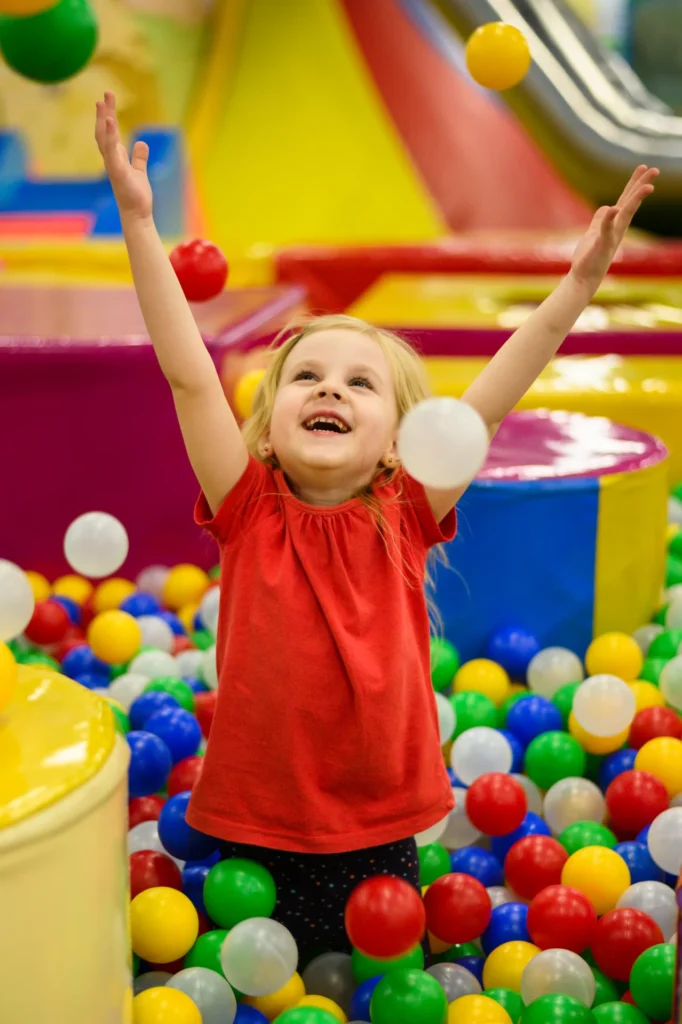 Colorful inflatable jumping castle set up in a backyard with children playing