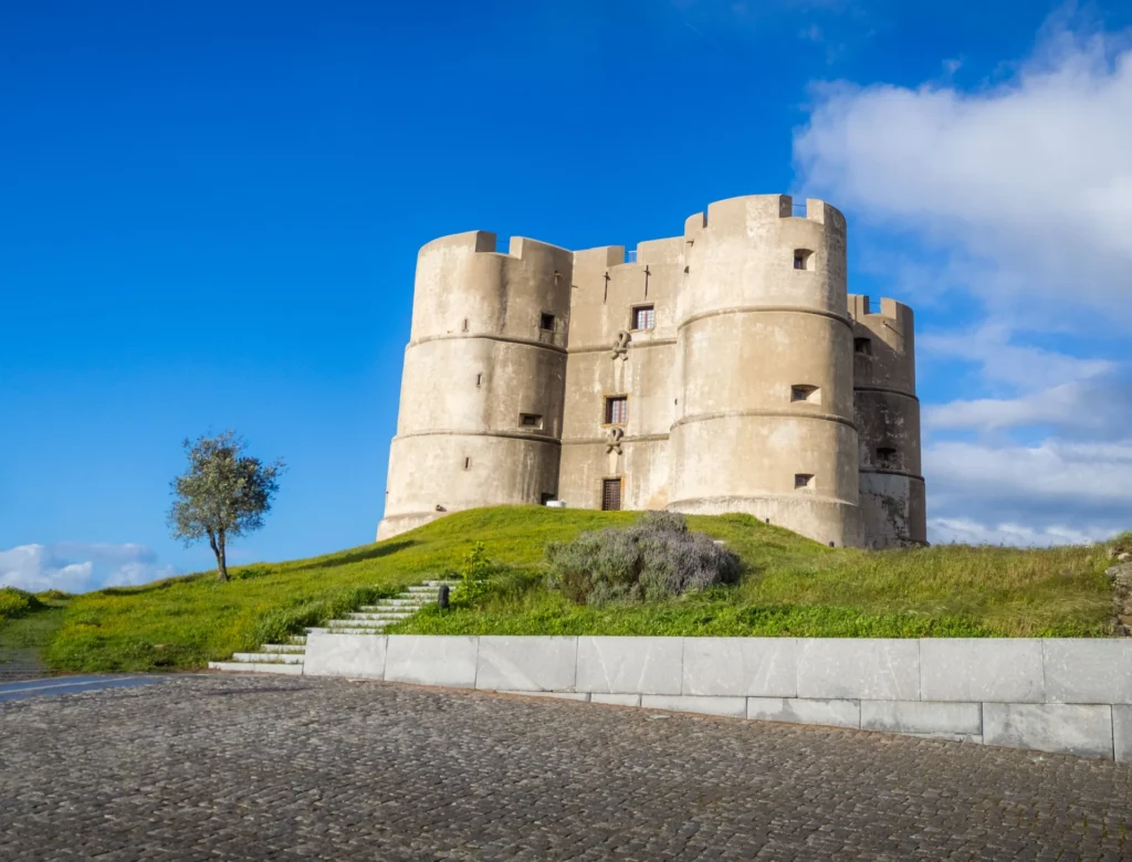 Illustration of a medieval stone castle alongside an inflatable jumping castle
