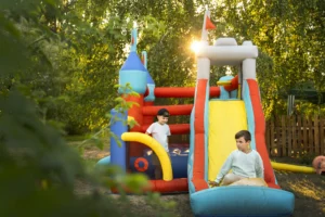 Colorful inflatable bounce house set up for a kids' party, showing a typical rental setup and size